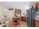 Traditional kitchen featuring wood cabinets, tile backsplash, and modern appliances at 6237 Nc 96 Hwy W, Youngsville, NC 27596