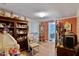 A cozy living room featuring wood floors, an area rug, and a display cabinet at 6237 Nc 96 Hwy W, Youngsville, NC 27596