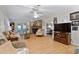 Bright living room with stone fireplace, ceiling fan, and view of the bedroom at 6237 Nc 96 Hwy W, Youngsville, NC 27596