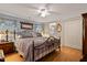 Spacious main bedroom with hardwood floors, ceiling fan, and an attached bathroom at 6237 Nc 96 Hwy W, Youngsville, NC 27596
