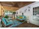 Relaxing screened-in porch featuring cozy seating, vintage decor, and a peaceful ambiance at 6237 Nc 96 Hwy W, Youngsville, NC 27596