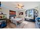 Cozy bedroom with a window seat, ceiling fan, and carpeting at 636 Copper Beech Ln, Wake Forest, NC 27587