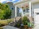 Charming home featuring a welcoming porch, brick stairs, and beautifully landscaped front yard at 636 Copper Beech Ln, Wake Forest, NC 27587
