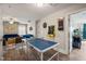 Game room with ping pong table, dart board, and view to the living room at 636 Copper Beech Ln, Wake Forest, NC 27587