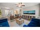Open game room with ping pong table and living room in the background at 636 Copper Beech Ln, Wake Forest, NC 27587