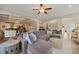 Spacious living room featuring a large sectional sofa, open layout, and access to dining area at 636 Copper Beech Ln, Wake Forest, NC 27587