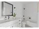 Stylish bathroom with tub-shower combo and built-in niche for storage at 6416 Tanner Oak Ln, Raleigh, NC 27613