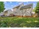 Large backyard showing mature trees, a deck, and partial fencing at 7019 Bellard Ct, Raleigh, NC 27617
