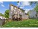 Fenced backyard, featuring mature trees, and a wood deck at 7019 Bellard Ct, Raleigh, NC 27617