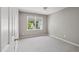Neutral bedroom with window showing an exterior view at 7019 Bellard Ct, Raleigh, NC 27617