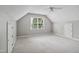 Spacious bedroom featuring a large window, ceiling fan, and neutral carpet at 7019 Bellard Ct, Raleigh, NC 27617