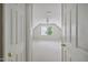 Spacious bedroom view through the doorway, featuring carpeting, a ceiling fan, and ample light at 7019 Bellard Ct, Raleigh, NC 27617