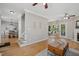 Open-concept living room featuring hardwood floors, a fireplace, and natural light at 7019 Bellard Ct, Raleigh, NC 27617
