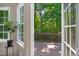 A lovely view to the wooden deck is shown through open french doors at 7019 Bellard Ct, Raleigh, NC 27617