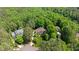 Overhead view of a lovely home nestled among mature trees and landscaping at 7212 Donneeford Rd, Wake Forest, NC 27587