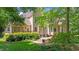 Expansive backyard features a stone patio, mature trees, and manicured lawn at 7212 Donneeford Rd, Wake Forest, NC 27587
