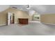 Finished basement with carpet, a wet bar, neutral paint, and a window with natural light at 7212 Donneeford Rd, Wake Forest, NC 27587