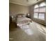 Bedroom with a plush bed and arched windows at 7212 Donneeford Rd, Wake Forest, NC 27587