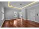 The primary bedroom is spacious and features hardwood floors and tray ceilings at 7212 Donneeford Rd, Wake Forest, NC 27587