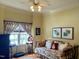 Cozy bedroom featuring a daybed, window seating, and unique decor at 7212 Donneeford Rd, Wake Forest, NC 27587