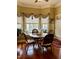 Charming breakfast nook with round table, cushioned window seat, and natural light at 7212 Donneeford Rd, Wake Forest, NC 27587
