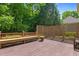 Outdoor deck with lattice privacy screen and a bench, perfect for entertaining guests at 7212 Donneeford Rd, Wake Forest, NC 27587