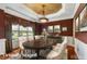 This dining room features wainscoting, a decorative ceiling, and a large window at 7212 Donneeford Rd, Wake Forest, NC 27587
