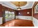 Formal dining room with hardwood floors, decorative ceiling, and large window at 7212 Donneeford Rd, Wake Forest, NC 27587