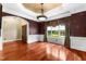 Formal dining room with hardwood floors, archway, and large window at 7212 Donneeford Rd, Wake Forest, NC 27587