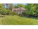 Stately home with a lush, green lawn and mature landscaping at 7212 Donneeford Rd, Wake Forest, NC 27587