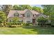 Charming two-story home with landscaped front yard and a combination of stone and siding exterior at 7212 Donneeford Rd, Wake Forest, NC 27587