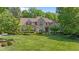 Beautiful home with manicured lawn, mature trees, and lush landscaping at 7212 Donneeford Rd, Wake Forest, NC 27587