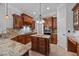 A well-appointed kitchen features custom cabinetry, granite countertops, and stainless steel appliances at 7212 Donneeford Rd, Wake Forest, NC 27587