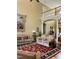 Cozy living room with hardwood floors, a tapestry, and staircase to the second floor at 7212 Donneeford Rd, Wake Forest, NC 27587