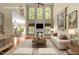 Open living room with fireplace and a view of the dining area and a bright sunny window at 7212 Donneeford Rd, Wake Forest, NC 27587
