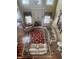 Top-down view of the living room with a fireplace, sofas, and area rug on hardwood floors at 7212 Donneeford Rd, Wake Forest, NC 27587