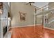 Spacious living room boasts hardwood floors, a fireplace, and staircase access to the upper level at 7212 Donneeford Rd, Wake Forest, NC 27587