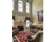 Cozy living room with a fireplace, plush seating, and a decorative rug on hardwood floors at 7212 Donneeford Rd, Wake Forest, NC 27587
