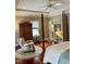 Elegant primary bedroom with a four-poster bed, wooden floors, and ample closet space at 7212 Donneeford Rd, Wake Forest, NC 27587