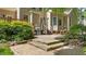 Outdoor patio with stone steps, stainless steel grill, and lush landscaping at 7212 Donneeford Rd, Wake Forest, NC 27587