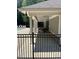 A covered section of the pool area with tables and chairs for entertaining near the sparkling pool at 7212 Donneeford Rd, Wake Forest, NC 27587