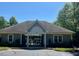 Community pool house with covered entrance, attractive grey exterior, and lush, verdant surroundings at 7212 Donneeford Rd, Wake Forest, NC 27587