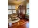 Relaxing sitting room features hardwood floors, a comfortable armchair, and natural light at 7212 Donneeford Rd, Wake Forest, NC 27587