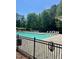 Community swimming pool surrounded by lounge chairs, perfect for relaxation and enjoyment on sunny days at 7212 Donneeford Rd, Wake Forest, NC 27587