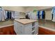 Expansive walk-in closet with custom shelving, drawers, and a central island at 7212 Donneeford Rd, Wake Forest, NC 27587