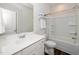 Clean bathroom with a white vanity, spacious tub, and wood-look flooring for a modern feel at 73 Windswept Way, Fuquay Varina, NC 27526