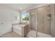 Bathroom with large soaking tub, walk-in shower and window with natural light at 73 Windswept Way, Fuquay Varina, NC 27526