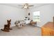 Cozy bedroom with carpet flooring and a window allowing for natural light at 73 Windswept Way, Fuquay Varina, NC 27526