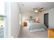 Neutral bedroom with a ceiling fan, carpet flooring, and two bedside lamps at 73 Windswept Way, Fuquay Varina, NC 27526