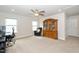 Spacious bonus room, complete with a ceiling fan, a stylish hutch, and large windows at 73 Windswept Way, Fuquay Varina, NC 27526
